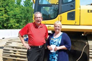 Ontario Minister of Agriculture, Food and Rural Affairs, Jeff Leal, was in Sharbot Lake briefly on a hot Tuesday morning to announce a new round of infrastructure funding. Using the backdrop of a project that received 90% of its funding from the first round of the Ontario Community Infrastructure Fund (OCIF) - namely the removal of an aging bridge on Road 38 over the Trans-Canada Trail - Leal announced that $50 million will be made available for projects in so-called rural communities in 2016. For the purposes of OCIF, municipalities with populations under 100,000 are defined as rural. Municipalities have until September 11 to file an expression of interest for 2016 funding. Unlike other infrastructure programs, which tend to be funded as a three-way partnership (1/3 provincial, 1/3 federal, and 1/3 municipal) OCIF funding is 90% provincial and 10% municipal. Central Frontenac Mayor Frances Smith thanked the province for providing the funding for “an improvement to Road 38, which as you can see is a busy road that is used by many of our permanent residents to access work, and by seasonal residents in North and Central Frontenac to get to their cottages.” Minister Leal, who spent 18 years on Peterborough town council before being elected as an MPP in 2003, said that when roads were downloaded by the Harris government in 1999, Eastern Ontario was the hardest hit region of the province, and the McGuinty and now Wynne governments have been attempting to address the resulting infrastructure gap for the last 12 years. Road 38 was one of the roads that was downloaded by the Harris government. Central Frontenac received a matching grant to resurface it in 2006, and is still paying off its own share of those costs. Leal did not indicate on Tuesday that the Wynne government is considering taking back responsibility for any of the roads that were downloaded under Mike Harris. Instead, he talked about partnerships and the OCIF program. The section of Road 38 that runs through South Frontenac, which was resurfaced by the Ministry of Transportation before the road was downloaded in 1999, has been earmarked for re-surfacing by South Frontenac staff, but the costs are too great for the township to cover on its own.